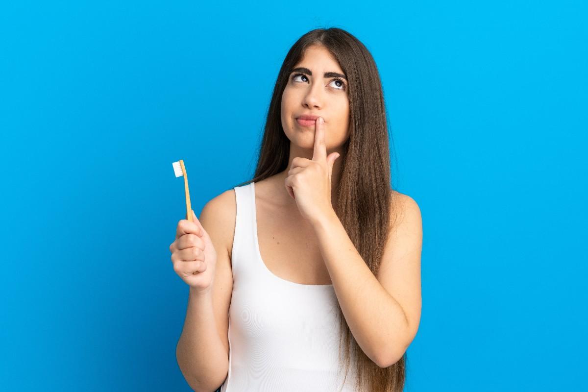 Do I need to brush my teeth after coffee before putting my aligners back in?